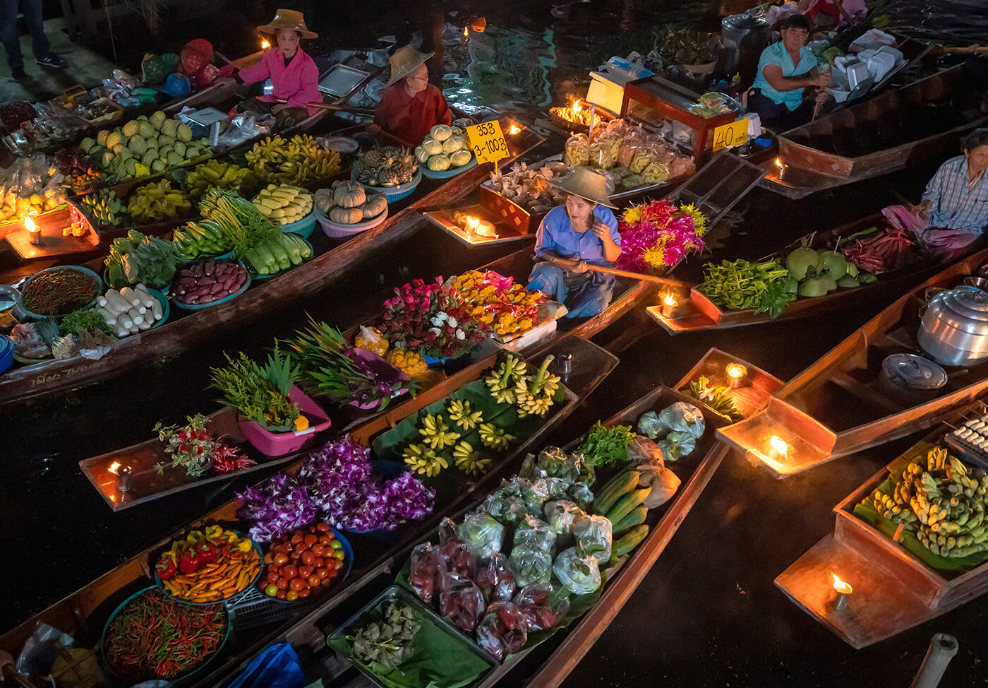 Start your journey with Damnoen Saduak’s vibrant glow